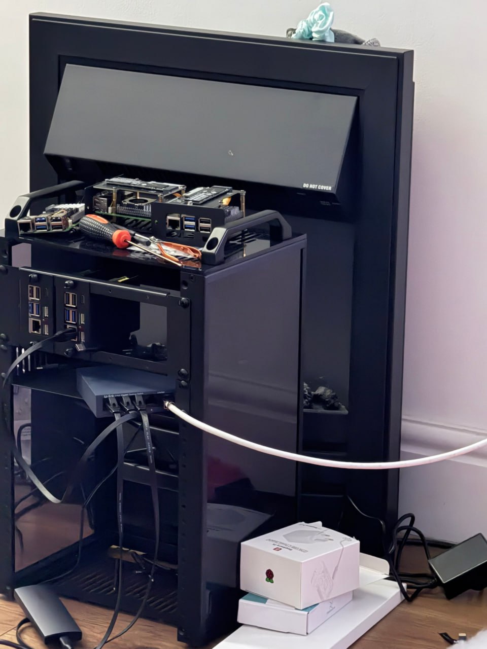 Homelab rack progress with Raspberry Pi nodes and network equipment in place.